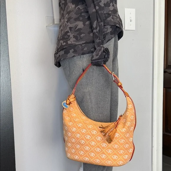 Dooney and Burke EUC. salmon color, canvas, swing style bag, key fob,storage - Picture 1 of 14